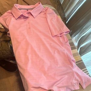 A pink golf shirt